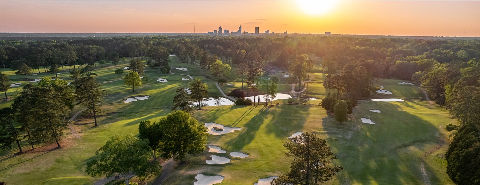 Aerial view of Raleigh Country Club golf course at sunset